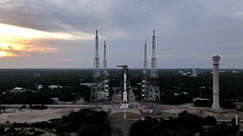 GSLV-F17 on the Second Launch Pad at Satish Dhawan Space Centre at dusk, with the four lightning towers and the umbilical tower flanking the 51.7 m rocket and the cryogenic upper stage visible at the top.