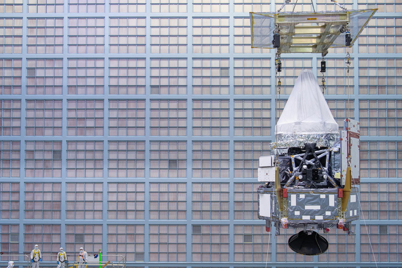 The Roman Space Telescope's Integrated Payload Assembly, crane-lifted in the cleanroom at Goddard Space Flight Center. NASA/Chris Gunn, GSFC_20250612_RST_034435.