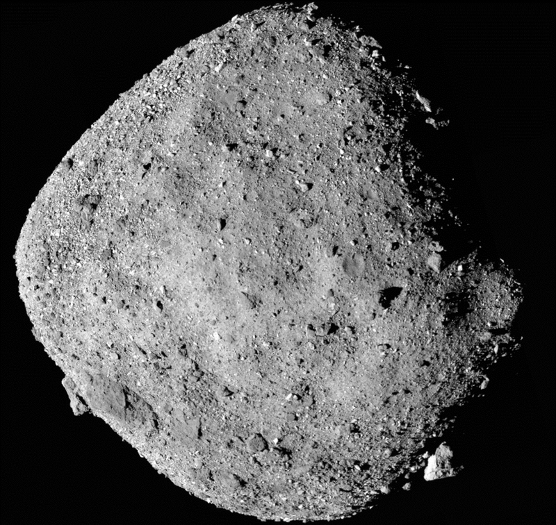 A diamond-shaped asteroid, Bennu, photographed against black space by NASA's OSIRIS-REx spacecraft from a range of 24 kilometres, showing a rubble-pile surface covered in boulders of various sizes