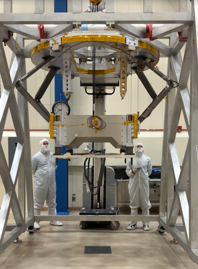 Engineers at Lockheed Martin in Denver monitor a static test of Dragonfly's pose mechanism, the assembly that lowers the rotorcraft clear of its backshell so the rotors can turn before separation during descent at Titan.