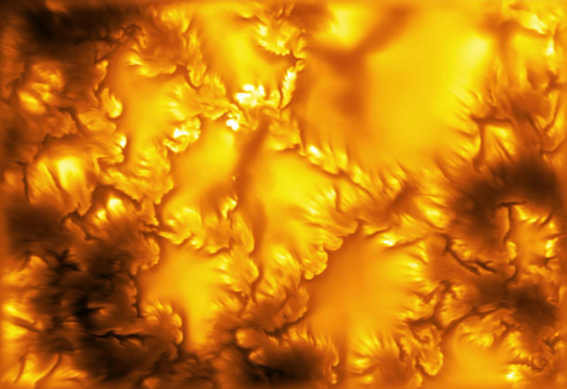 The highest-resolution image of the Sun's photosphere ever captured, taken at 416 nm by the Inouye Solar Telescope, showing granulation cells in golden orange with darker intergranular lanes and small vortex-like swirls along the edges of magnetic structures. Image source: NSF/NSO/AURA/MPS.