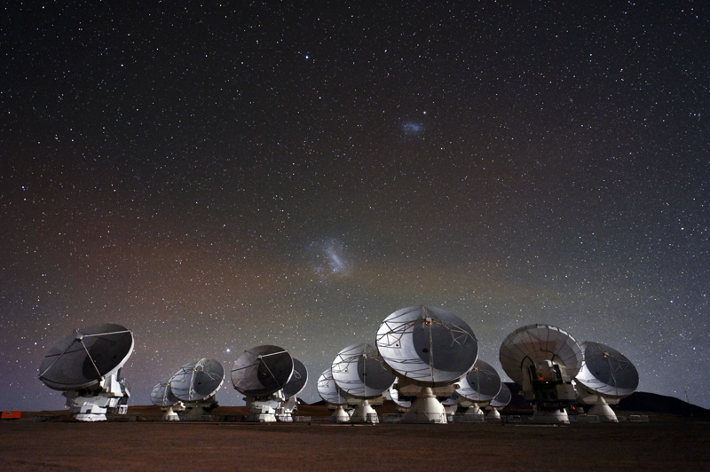 ALMA antennas on the Chajnantor plateau under the Magellanic Clouds